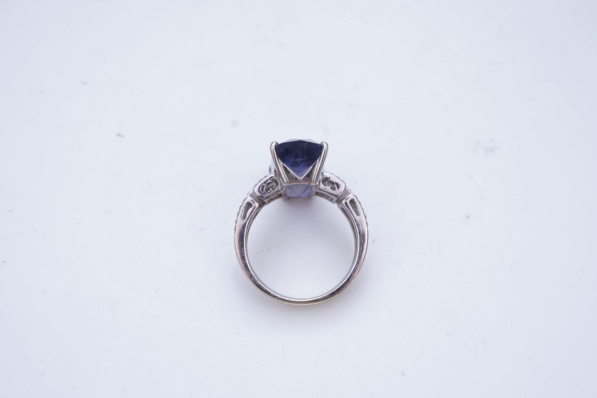 An iolite and diamond ring